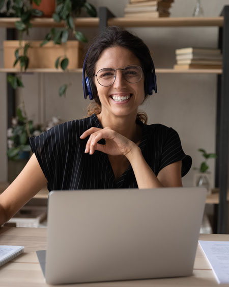 a person wearing headphones and smiling