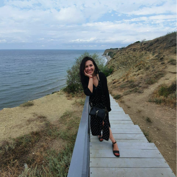 a person standing on a boardwalk